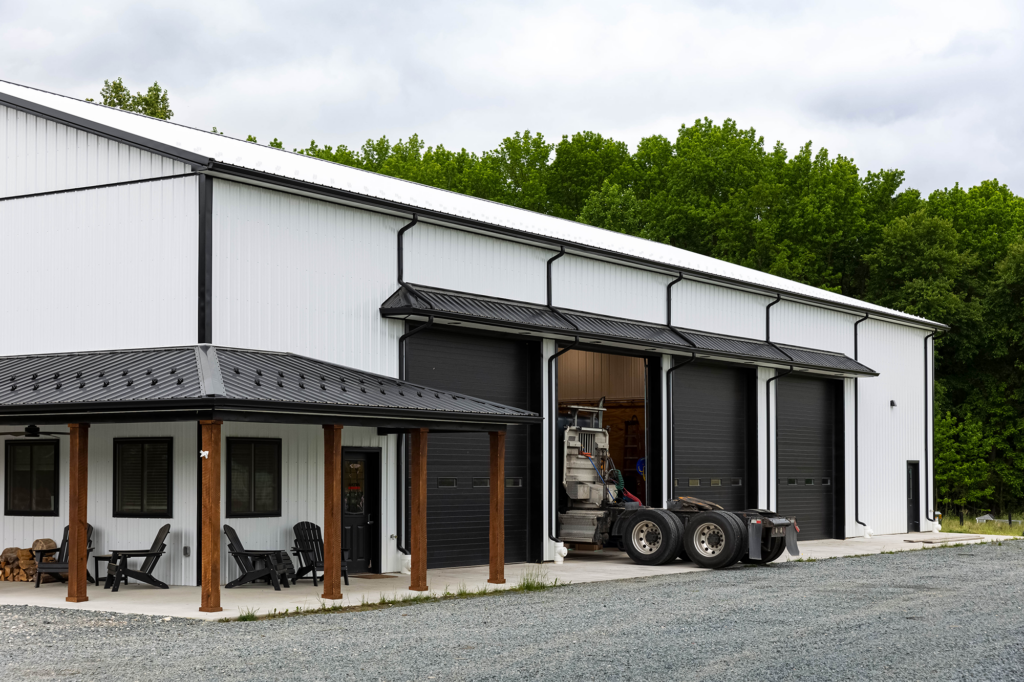 Semi truck pulling into a custom commercial garage