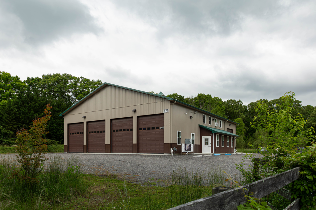 View of multiple overhead doors on a pole barn